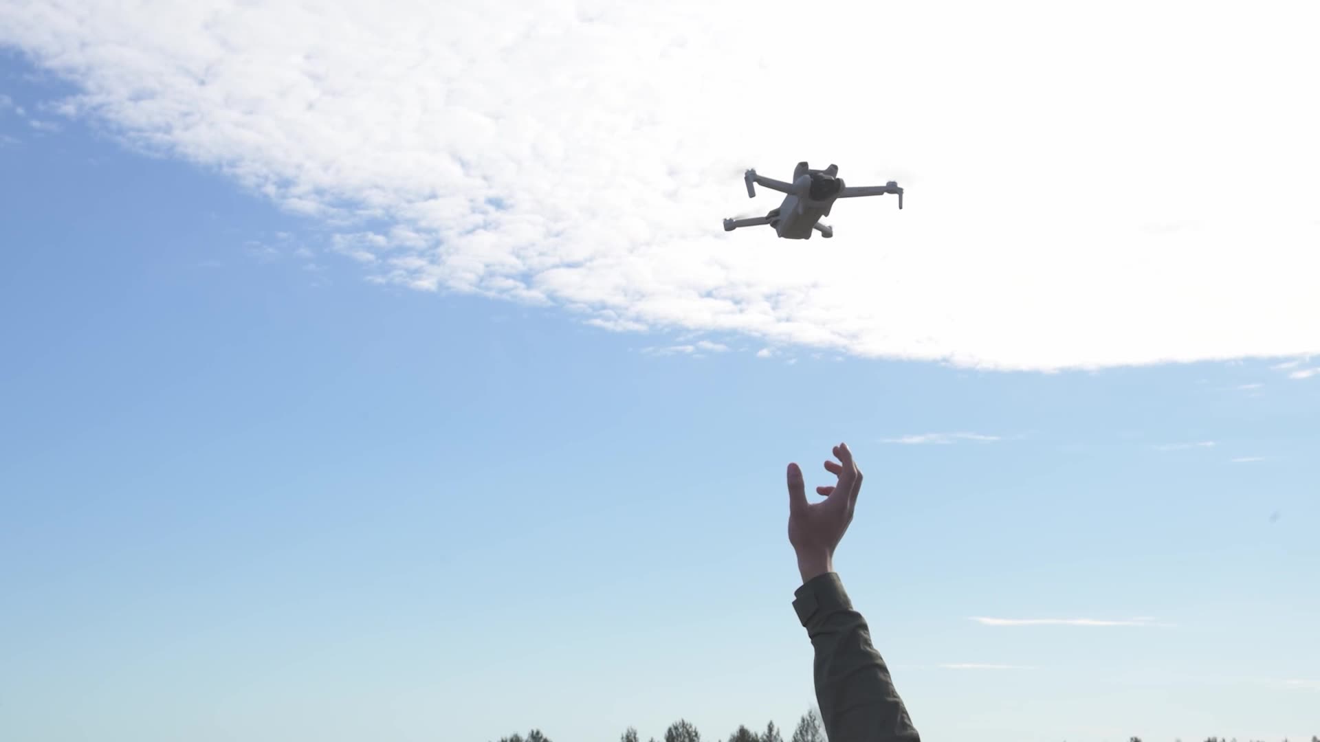 Operator launching a quadcopter during a counter-drone exercise