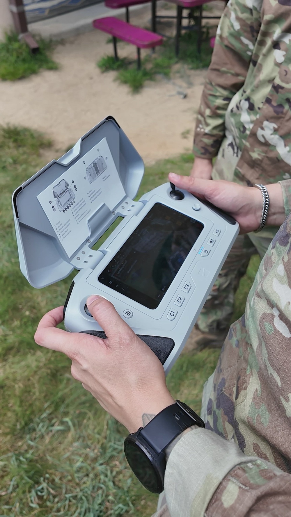 Air-defense gunners tracking aerial targets during joint counter-drone training