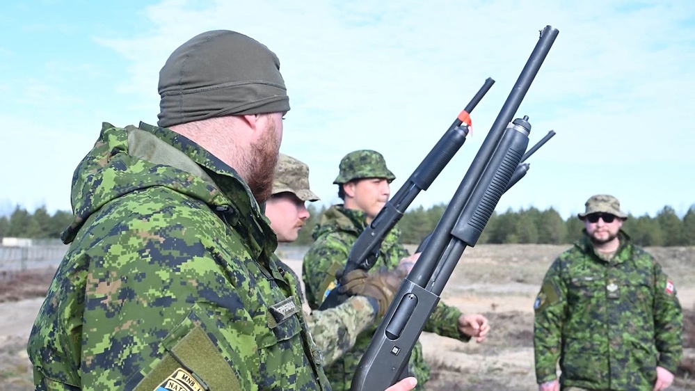 Coalition service members conducting counter-drone field training with scoped weapon systems